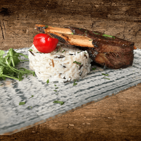 Coaste de vită cu rizotto , piure de țelină și salată de rucola